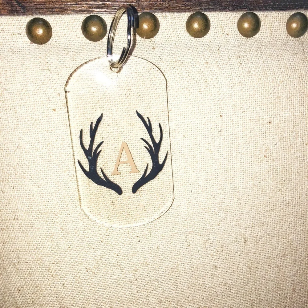 A MONOGRAMMED deer antler keychain